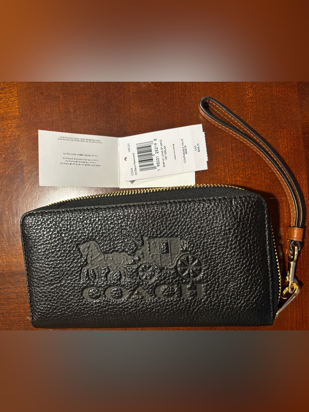 Coach Black Pebbled Leather Zip Wristlet with Embossed Carriage